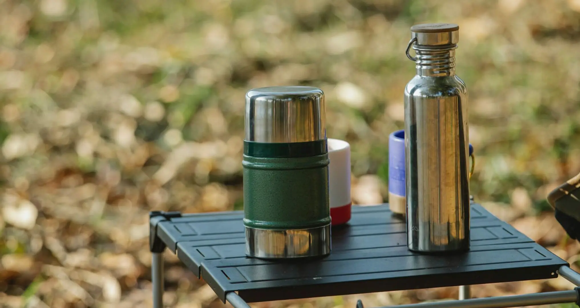 Front Page -Survival Gear Hub reusable water bottles on camping table
